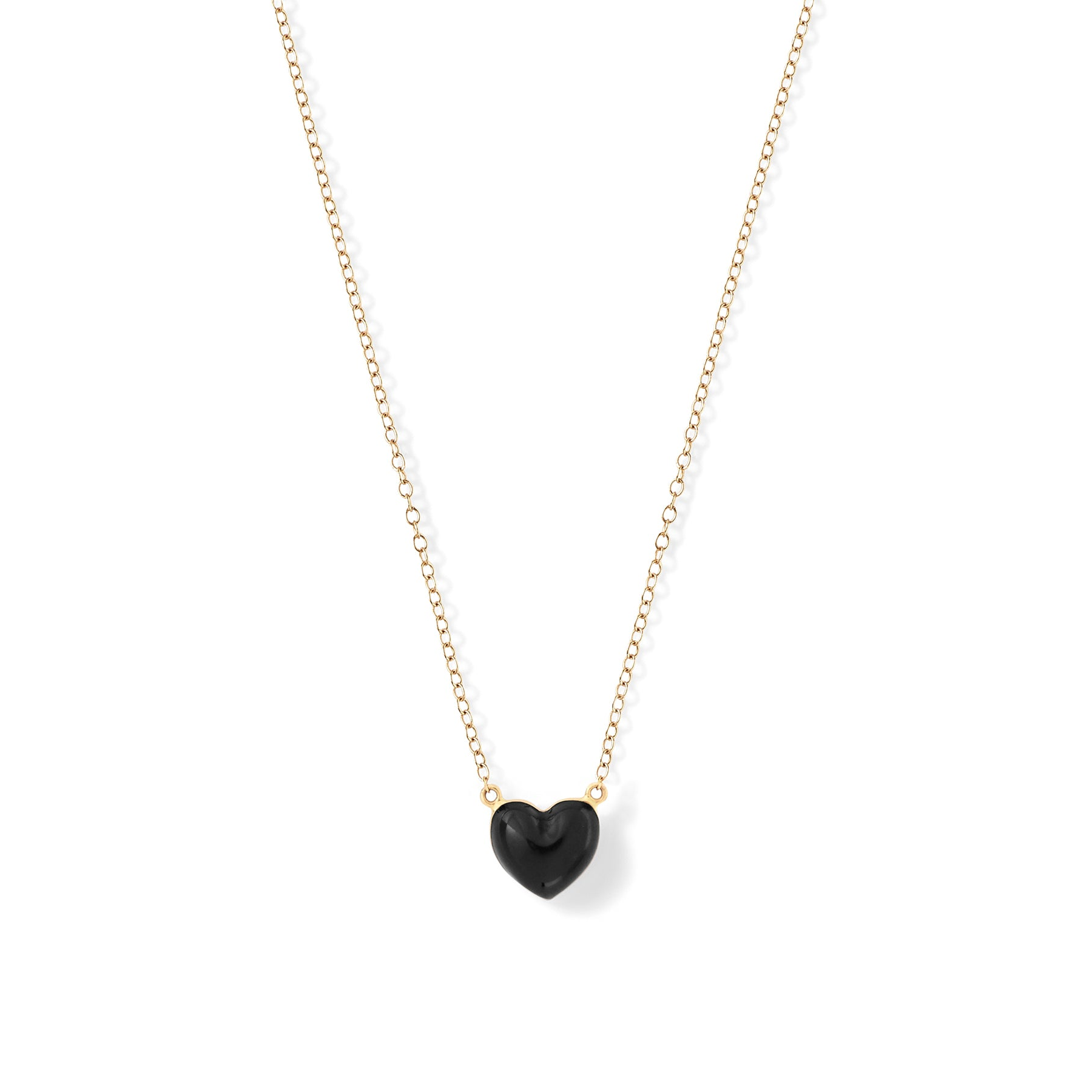 Noir | A gold-colored chain necklace with a black heart-shaped pendant.