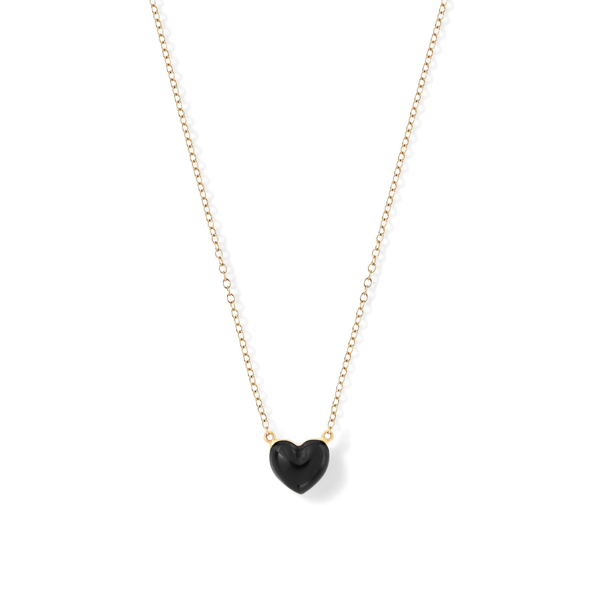 Noir | A gold-colored chain necklace with a black heart-shaped pendant.